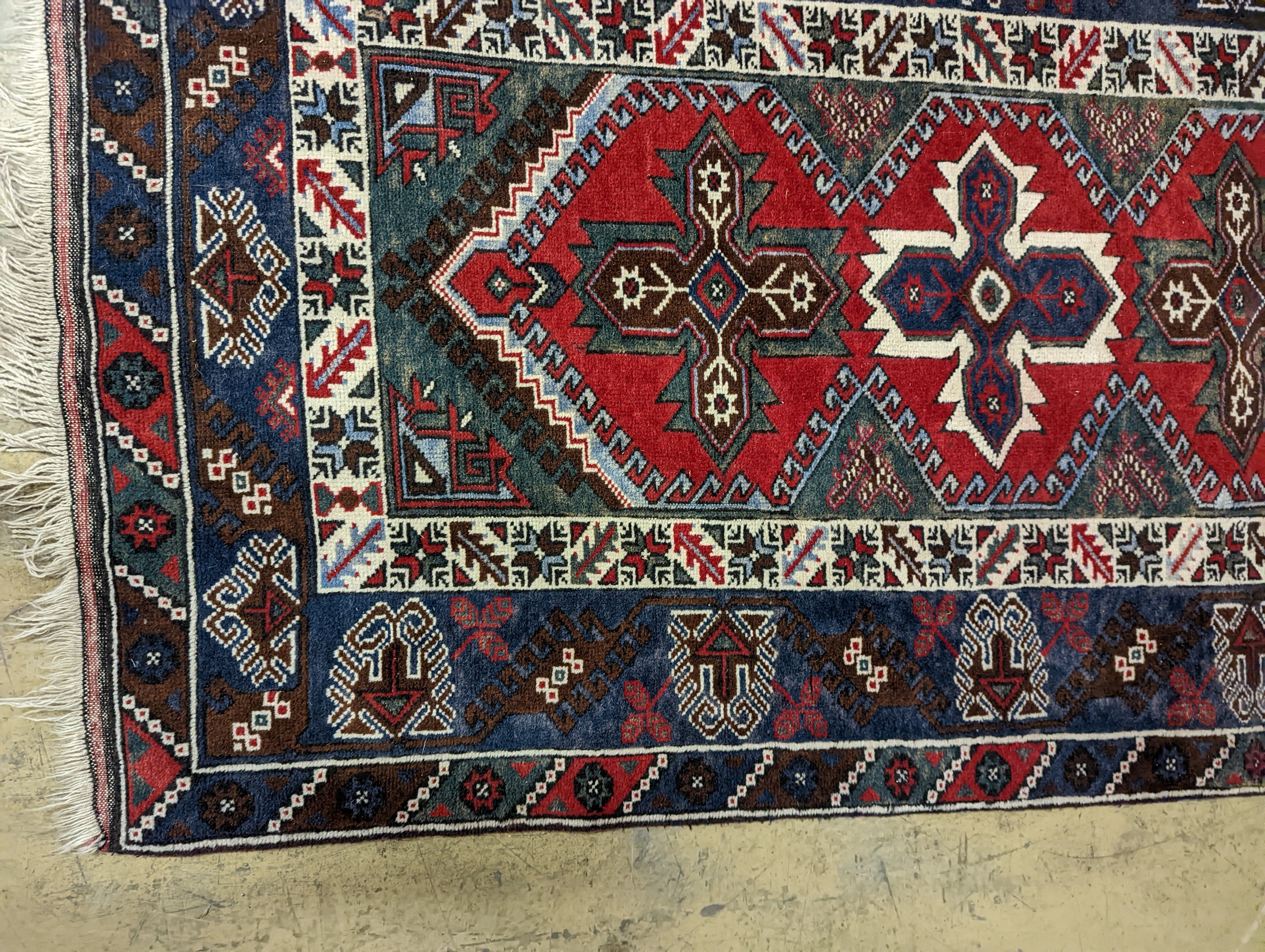 Two Turkish rugs and a Persian rugs. Largest, 284x172cm.
